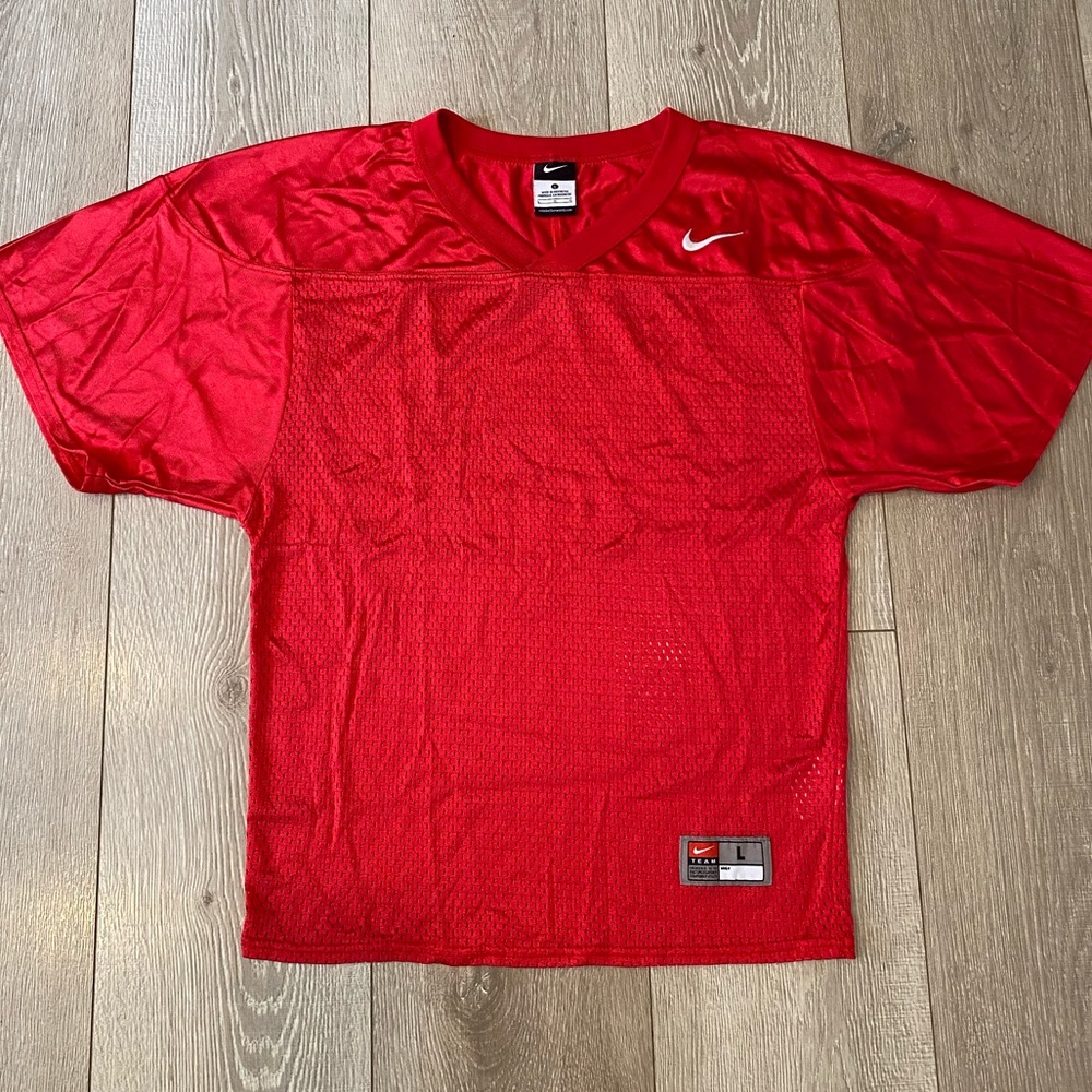 Boys red Nike football practice jersey
